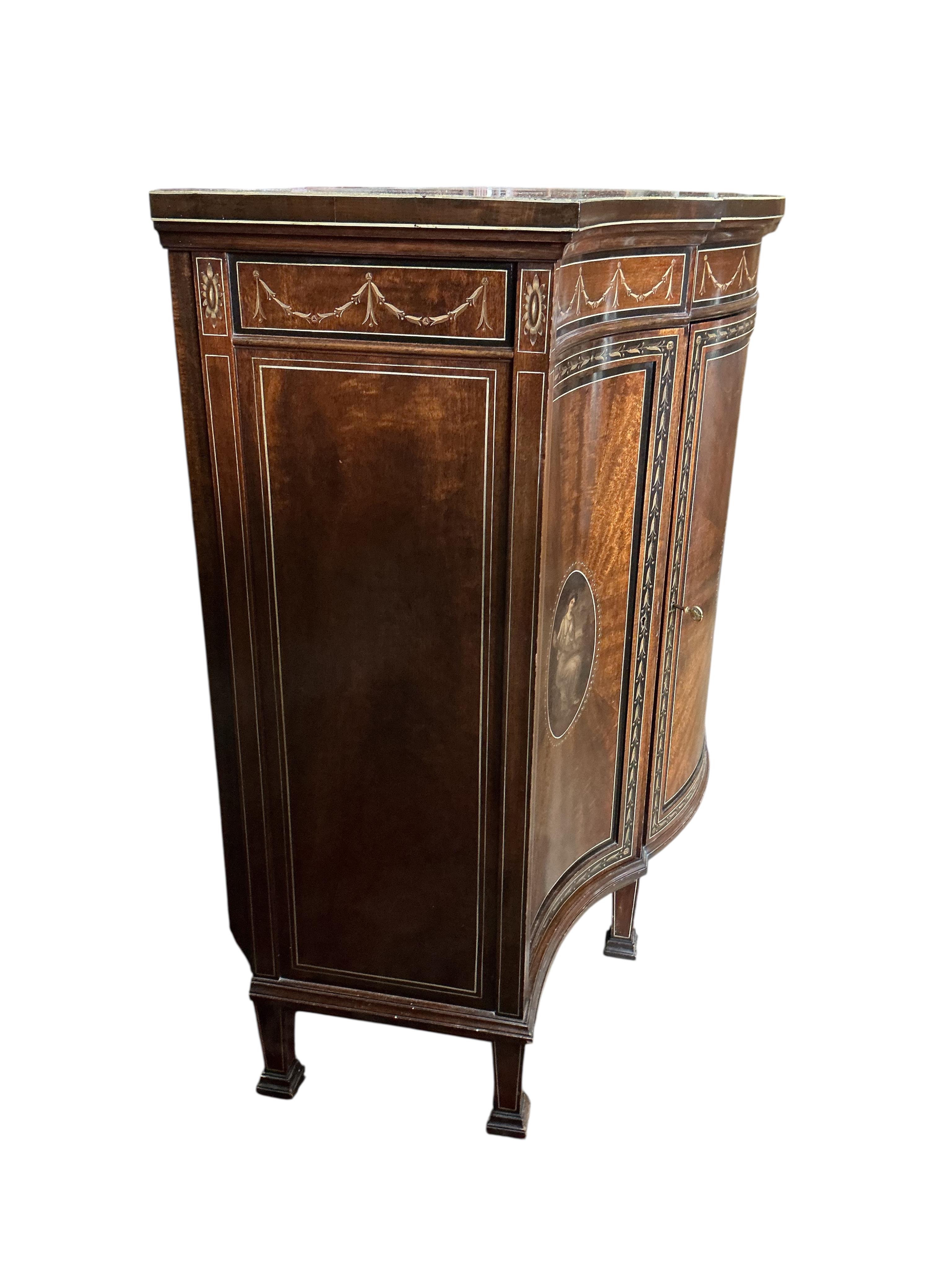 An Edwardian Sheraton Revival painted mahogany bowfront side cabinet